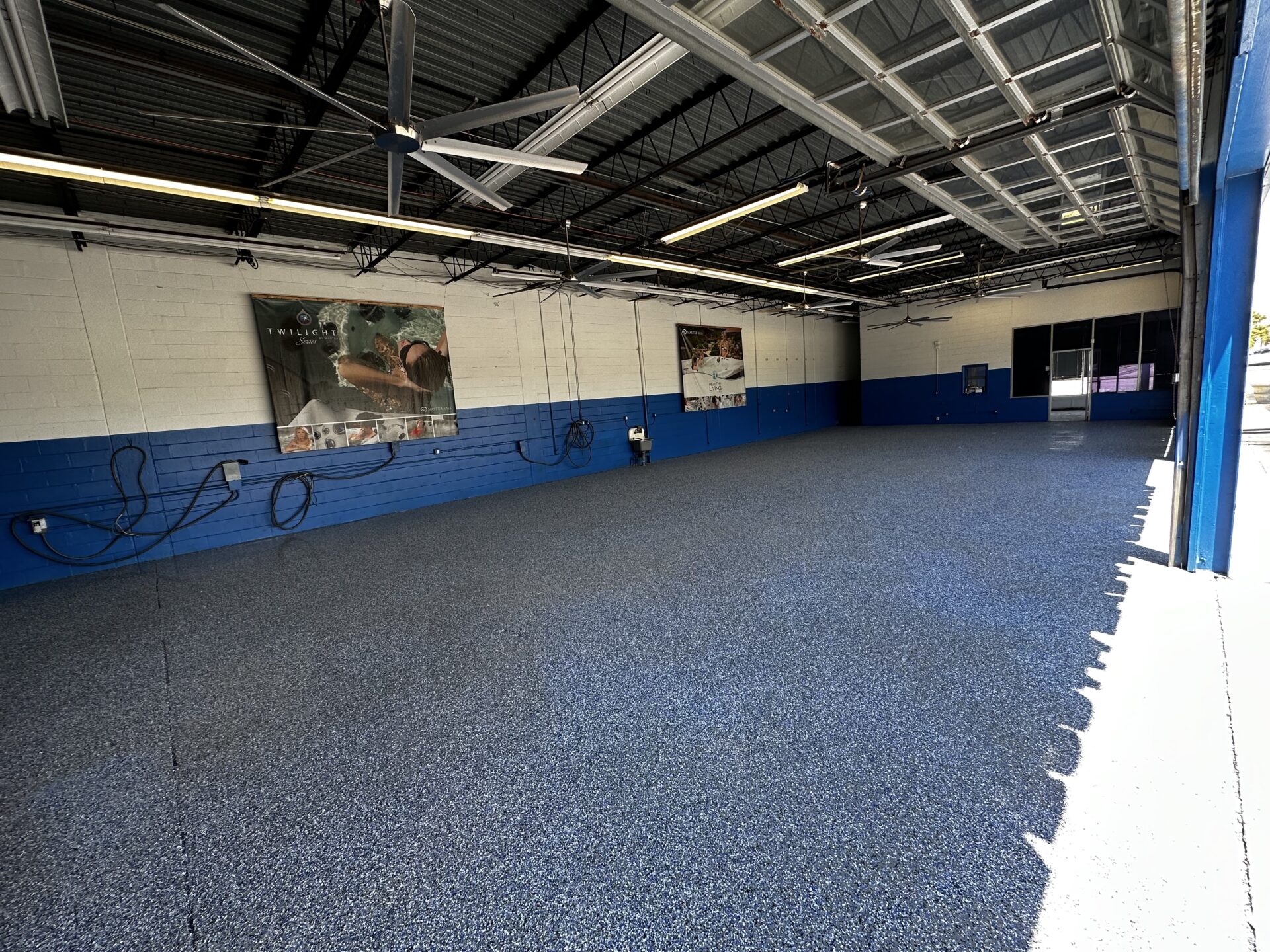 A room with blue walls and a large floor.