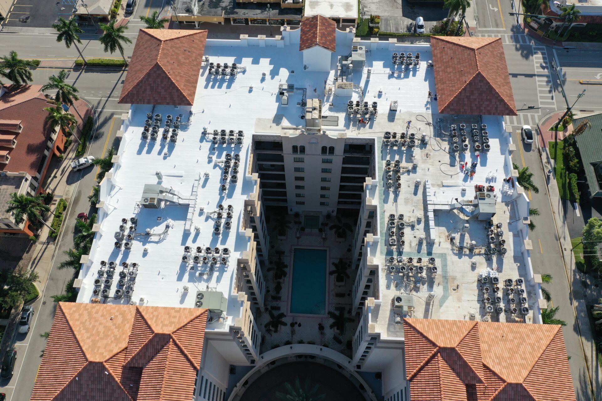 A building with many roofs and a pool
