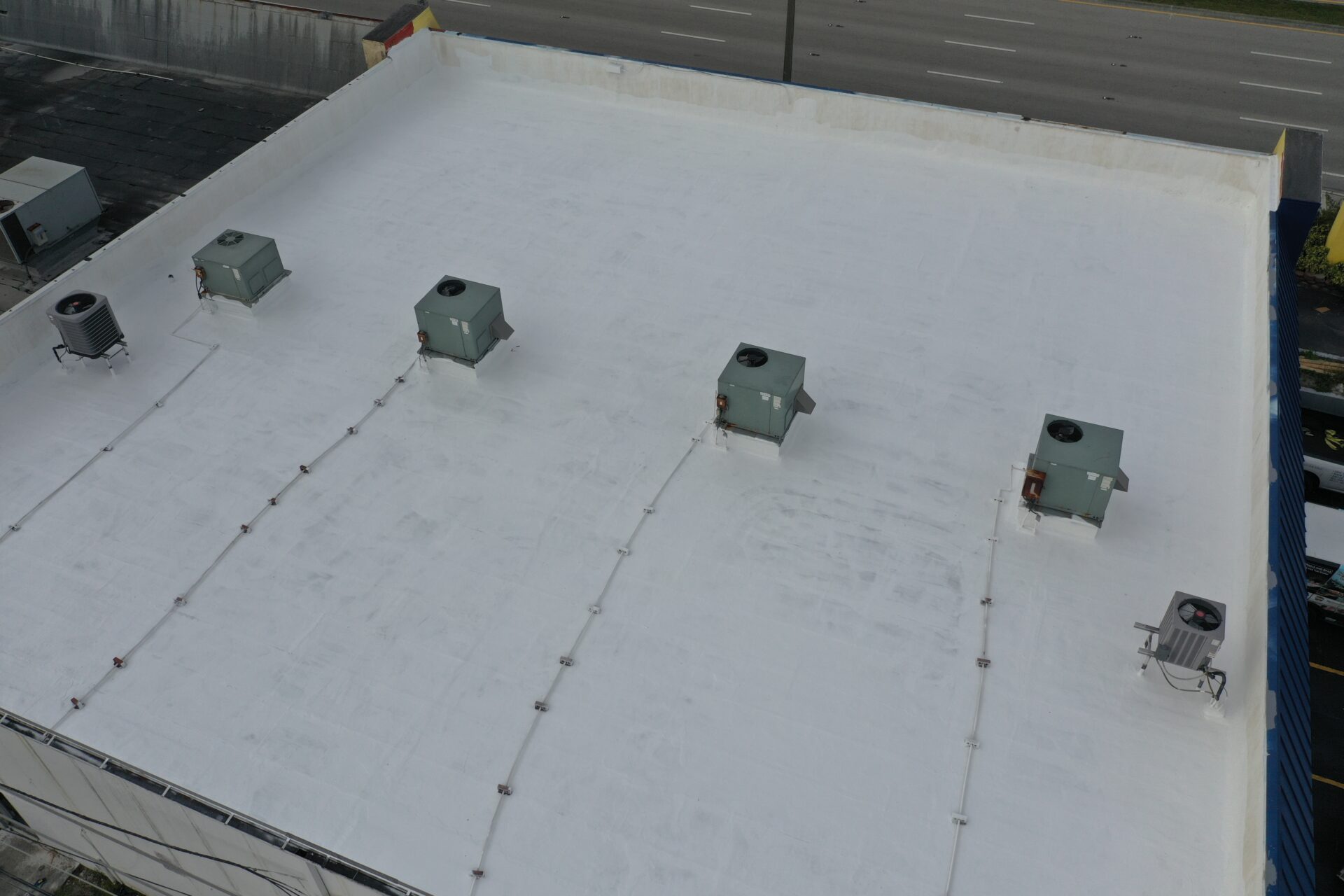 A white roof with four bolts on it.